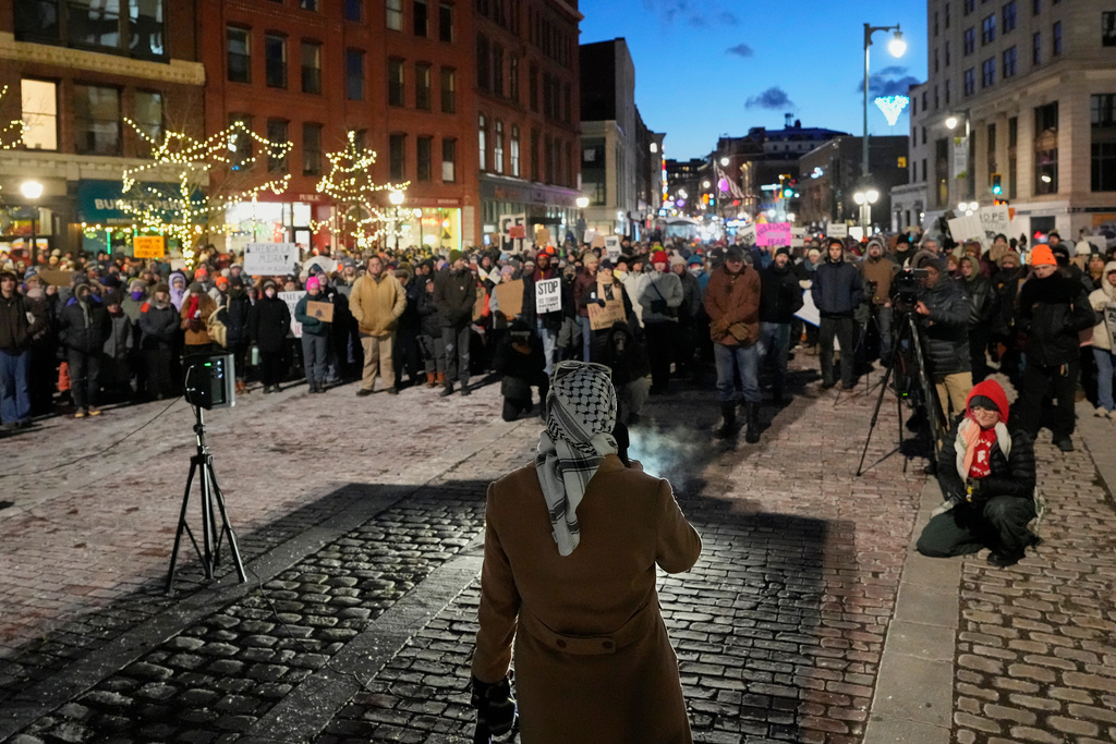 Protesters rally against the presence of U.S. Immigration Customs Enforcement in Maine, Friday, Jan. 23, 2026, in Portland, Maine. (AP Photo/Robert F. Bukaty)