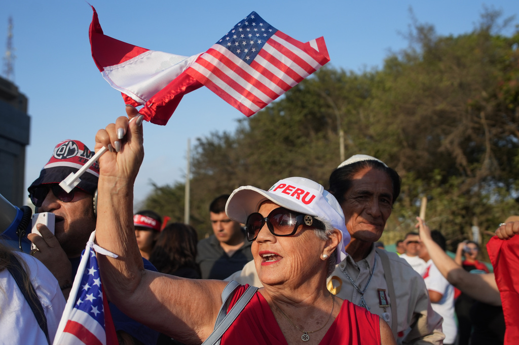 Supporters of presidential candidate Rafael Lopez Aliaga, of the Popular Renewal party, rally in Lima, Peru, Sunday, April 19, 2026. (AP Photo/Guadalupe Pardo)