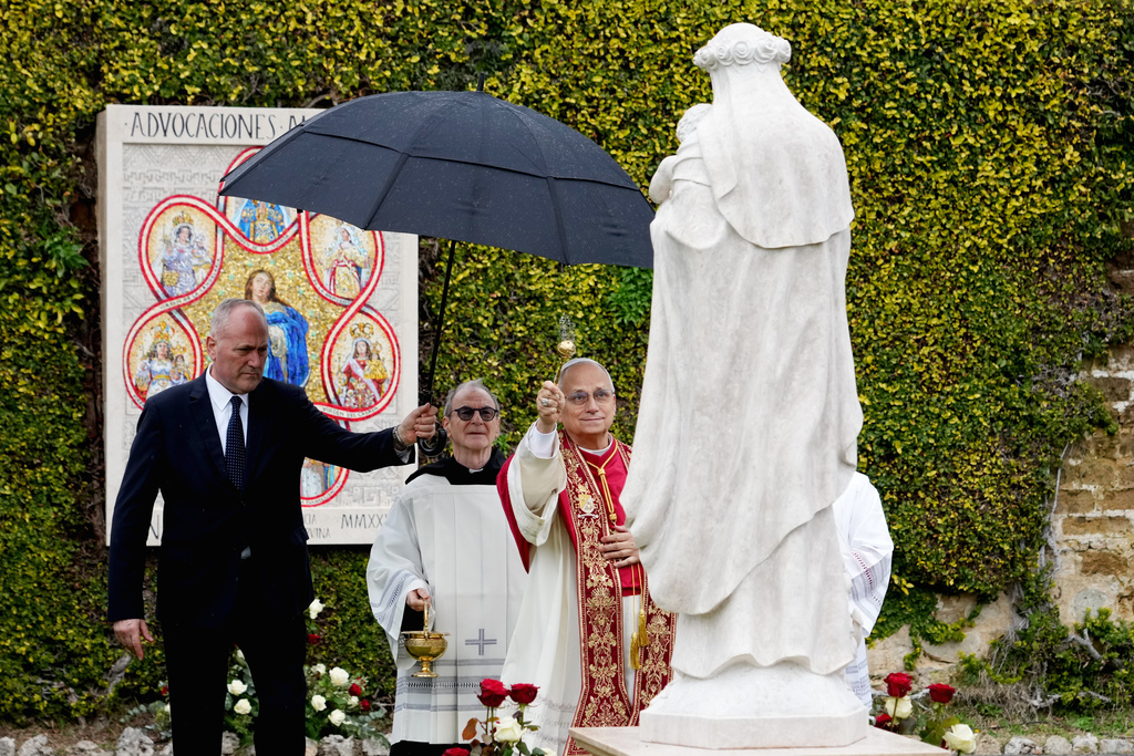 Pope Leo XIV blesses a mosaic of the Virgin Mary and a statue of St. Rose of Lima in the Vatican Gardens, Saturday, Jan. 31, 2026. (AP Photo/Andrew Medichini)