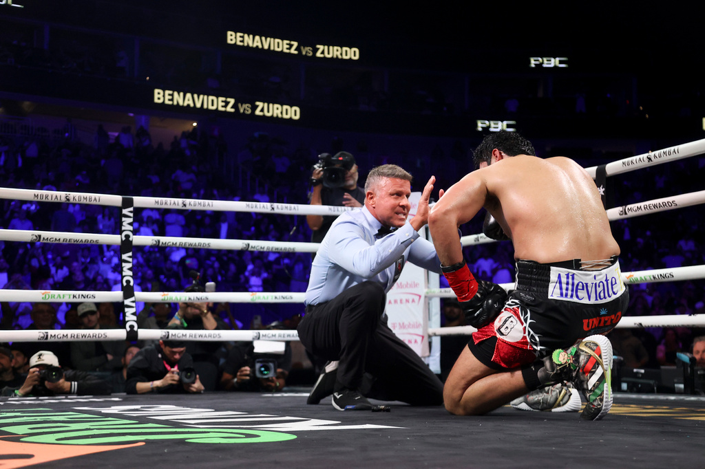 Thomas Taylor gives a count to Gilberto Ramirez in a cruiserweight championship boxing match Saturday, May 2, 2026, in Las Vegas. (AP Photo/Ian Maule)