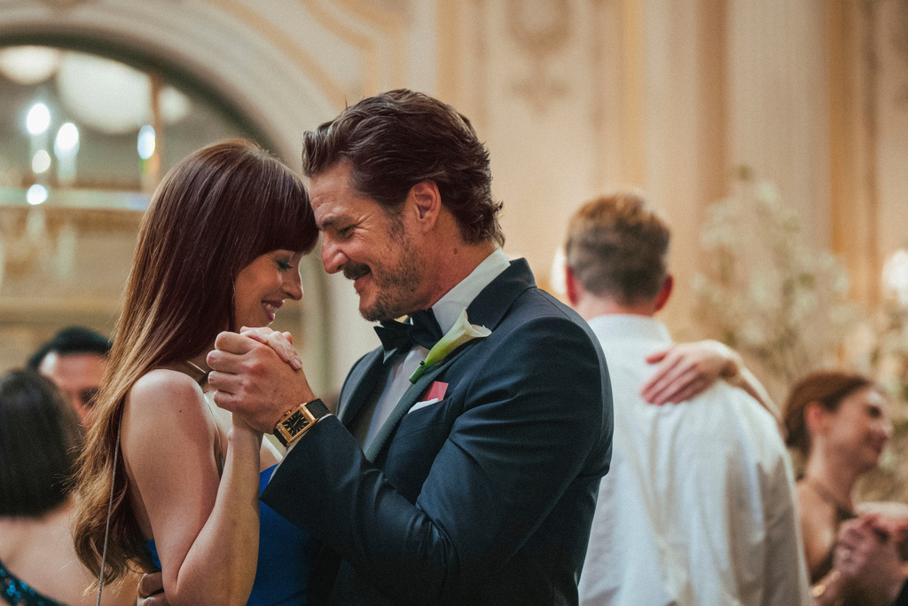 This image released by A24 shows Dakota Johnson, left, and Pedro Pascal in a scene from "Materialists." (A24 via AP)