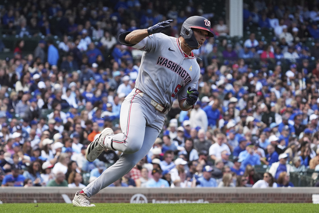 Washington Nationals' Daylen Lile runs after hitting a single during the fifth inning of a baseball game against the Chicago Cubs in Chicago, Sunday, Sept. 7, 2025. (AP Photo/Nam Y. Huh)