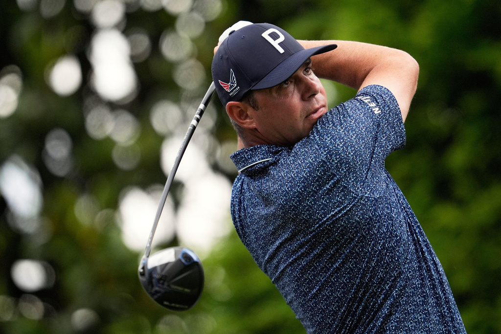 FILE - Gary Woodlands watches his tee shot on the 16th hole during a practice round for the PGA Championship golf tournament at the Quail Hollow Club, May 14, 2025, in Charlotte, N.C. (AP Photo/George Walker IV, File)