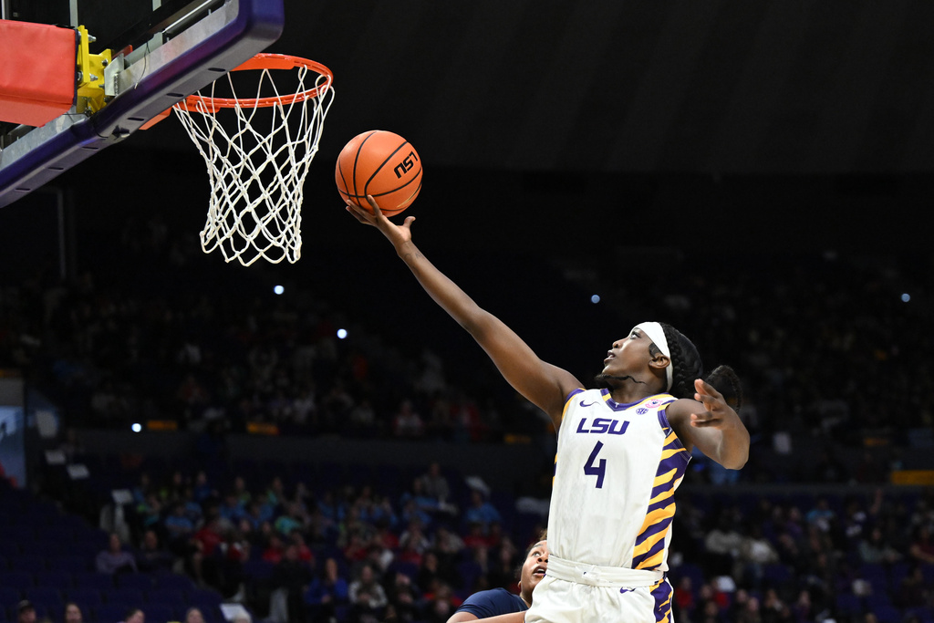 LSU guard Flau'Jae Johnson (4) shoots in the first half of an NCAA college basketball game against Morgan State, Tuesday, Dec. 16, 2025, in Baton Rouge, La. (AP Photo/Ella Hall)