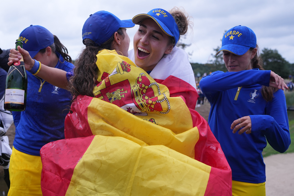 Nastasia Nadaud of Europe, second right, celebrates with teamates after they won the Solheim Cup on the final day in Den Bosch, Netherlands, Sunday, Sept. 13, 2026. (AP Photo/Alastair Grant)