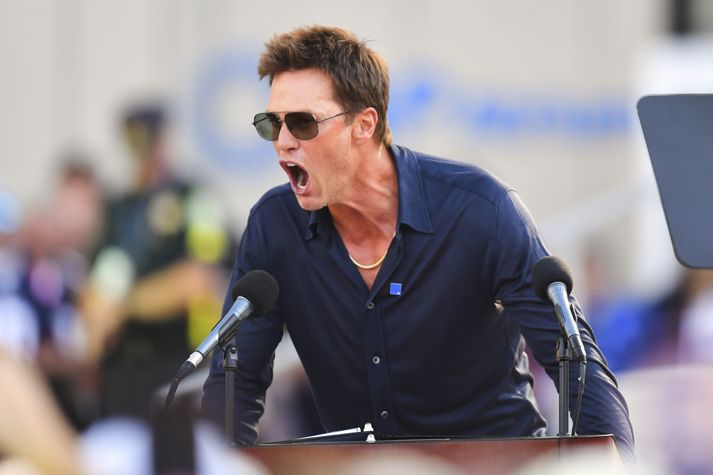 Former New England Patriots quarterback Tom Brady speaks after a bronze statue of himself was unveiled in Patriot Place Plaza before an NFL preseason football game between the Washington Commanders and the New England Patriots Friday, Aug. 8, 2025, in Foxborough, Mass. (AP Photo/Charles Krupa)