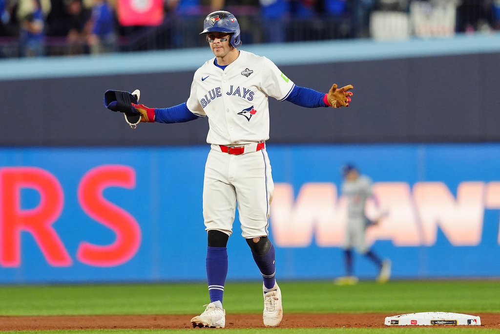 Toronto Blue Jays' Ernie Clement reacts after hitting a double against the Los Angeles Dodgers during the eighth inning in Game 7 of baseball's World Series in Toronto on Saturday, Nov. 1, 2025. (Frank Gunn/The Canadian Press via AP)