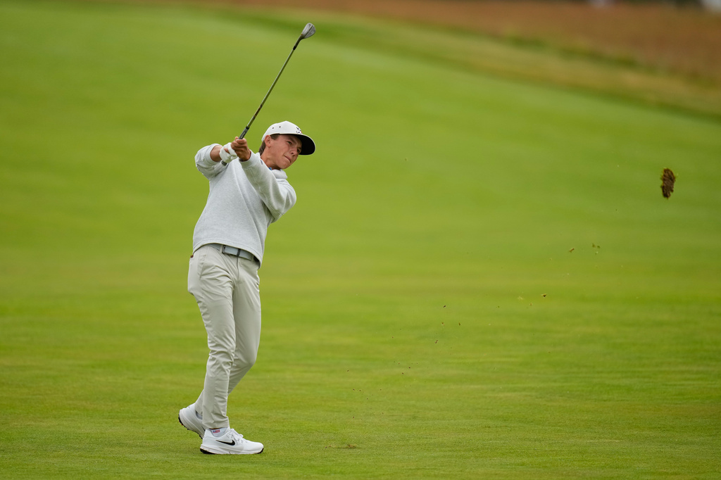 Miles Russell hits from the fairway on the third hole during the first round of the U.S. Open golf tournament at Shinnecock Hills Golf Club in Southampton, N.Y., Thursday, June 18, 2026.(AP Photo/Seth Wenig)