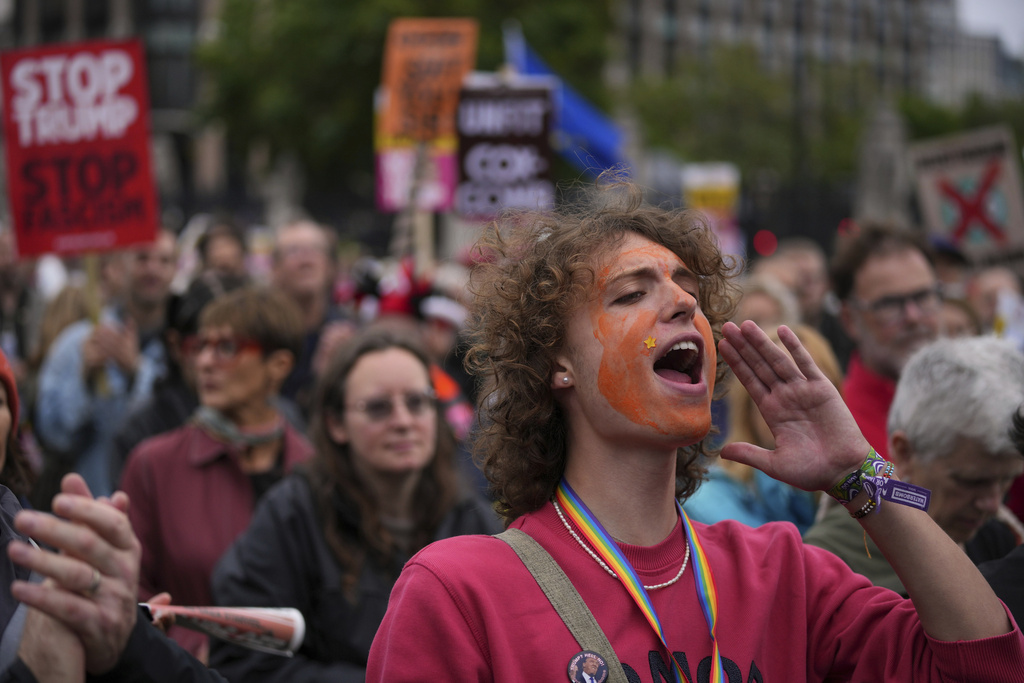 Stop Trump Coalition campaigners take part in a protest march against President Donald Trump's state visit in London, Wednesday, Sept. 17, 2025.(AP Photo/Kin Cheung)