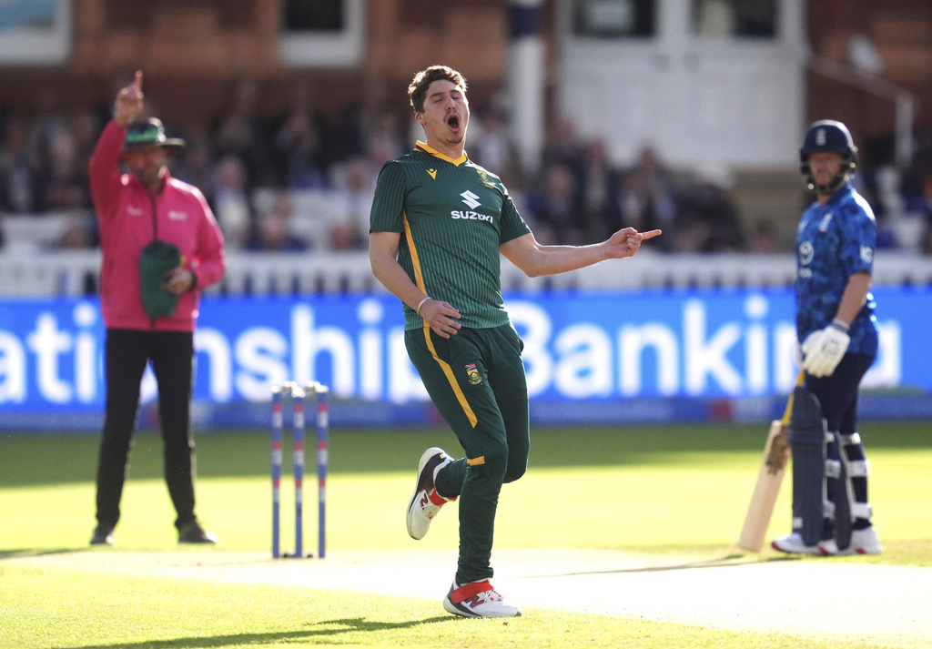 South Africa's Nandre Burger celebrates taking the wicket of England's Jamie Smith during the second ODI series cricket match between England and South Africa, at Lord's, in London, Thursday Sept. 4, 2025. (Adam Davy/PA via AP)