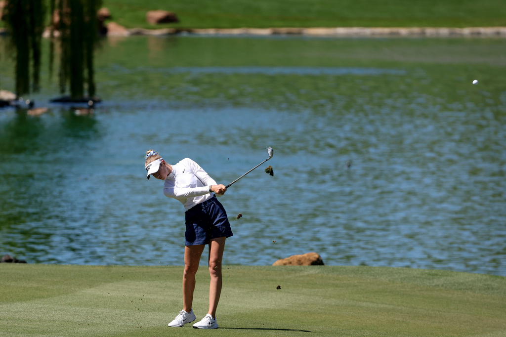 Nelly Korda hits an approach shot on the fourth hole during the final round of the Aramco Championship golf tournament Sunday, April 5, 2026, in North Las Vegas, Nev. (AP Photo/Ian Maule)