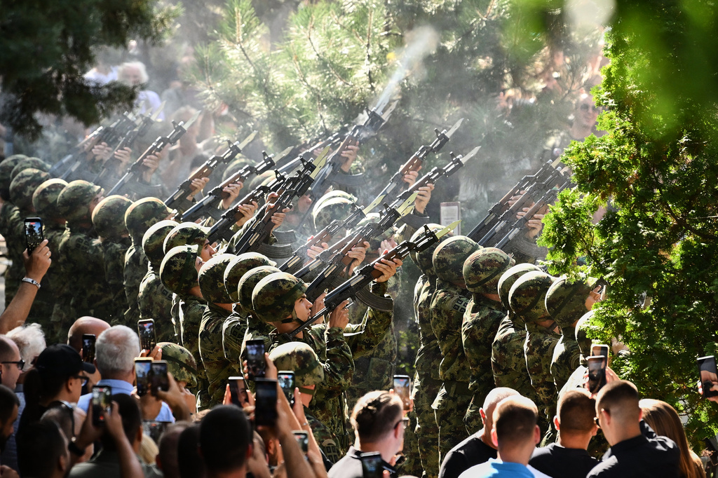 Serbian national military servicemen fire a three-volley salute during the funeral of former Bosnian Serb army commander Ratko Mladic, who died last week while serving a life sentence for genocide and other atrocities during the war in Bosnia, at the Topcider Cemetery, in Belgrade, Serbia, Monday, Sept. 7, 2026. (AP Photo)