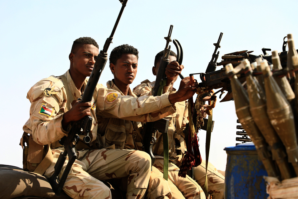 FILE - Sudanese soldiers from the Rapid Support Forces unit patrol during a rally for Dagalo, in Garawee town, north of Sudan, Saturday, June 15, 2019. (AP Photo)
