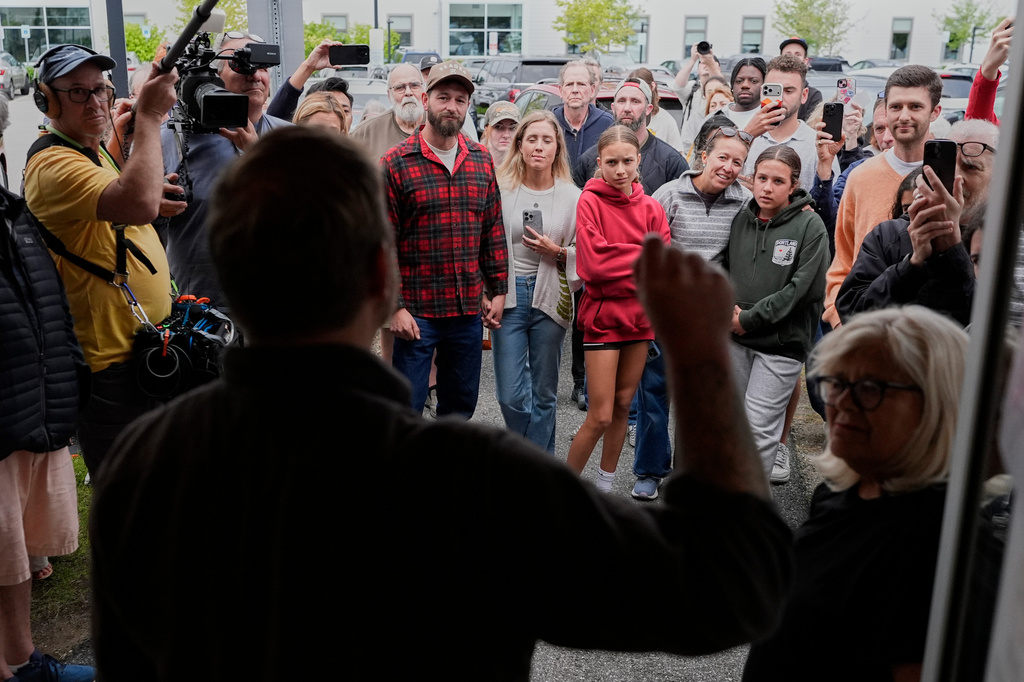 Graham Platner, Democratic candidate for U.S. Senate, speaks to an overflow crowd outside a campaign event Sunday, June 7, 2026, in Portland, Maine. (AP Photo/Robert F. Bukaty)