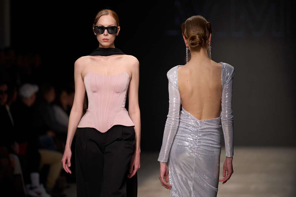 Models wear a creation by Russian brand MME on a runway at the Moscow Fashion Week in Moscow, Sunday, March 15, 2026. (AP Photo/Alexander Zemlianichenko)