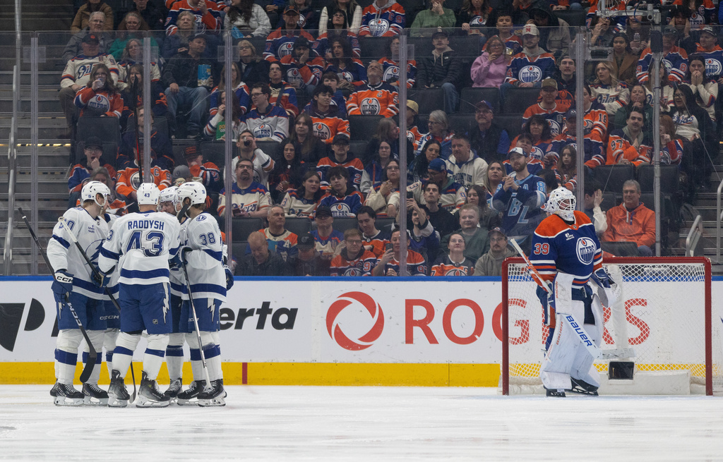 Tampa Bay Lightning players celebrate a goal against the Edmonton Oilers during the second period of an NHL hockey game in Edmonton on Saturday, March 21, 2026. (Jason Franson/The Canadian Press via AP)
