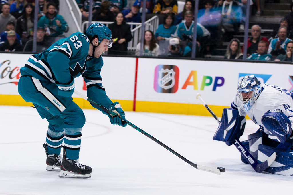 Toronto Maple Leafs goaltender Anthony Stolarz (41) saves a shot by San Jose Sharks center Zack Ostapchuk (63) during the first period of an NHL hockey game in San Jose, Calif., Thursday, April 2, 2026. (AP Photo/John Hefti)
