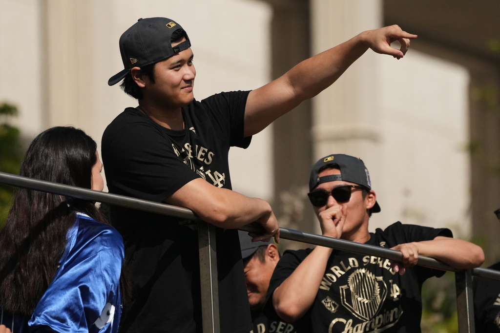Los Angeles Dodgers' Shohei Ohtani points to fans during a parade to celebrate the baseball team's World Series win on Monday, Nov. 3, 2025, in Los Angeles. (AP Photo/Jae C. Hong)