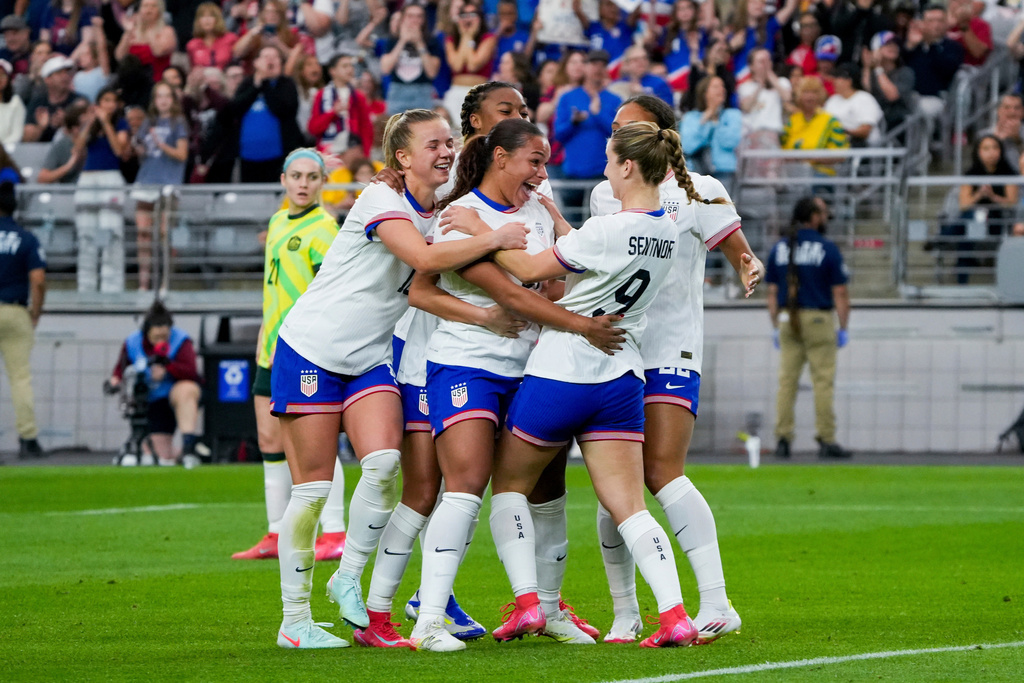 FILE - United States forward Michelle Cooper celebrates her first international goal with her teammates during the second half of a group stage match in the SheBelieves Cup women's soccer tournament against Australia, in Glendale, Ariz., Feb. 23, 2025. (AP Photo/Samantha Chow, File)