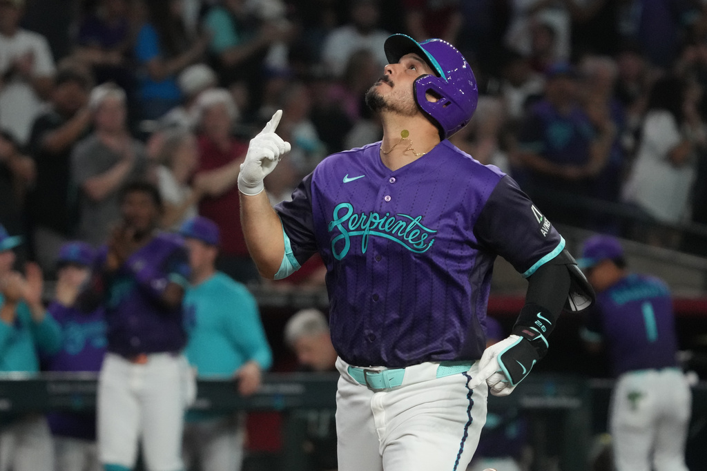 Arizona Diamondbacks' Nolan Arenado celebrates after hitting a solo home run against the Los Angeles Dodgers in the second inning of a baseball game, Friday, Aug 7, 2026, in Phoenix. (AP Photo/Rick Scuteri)