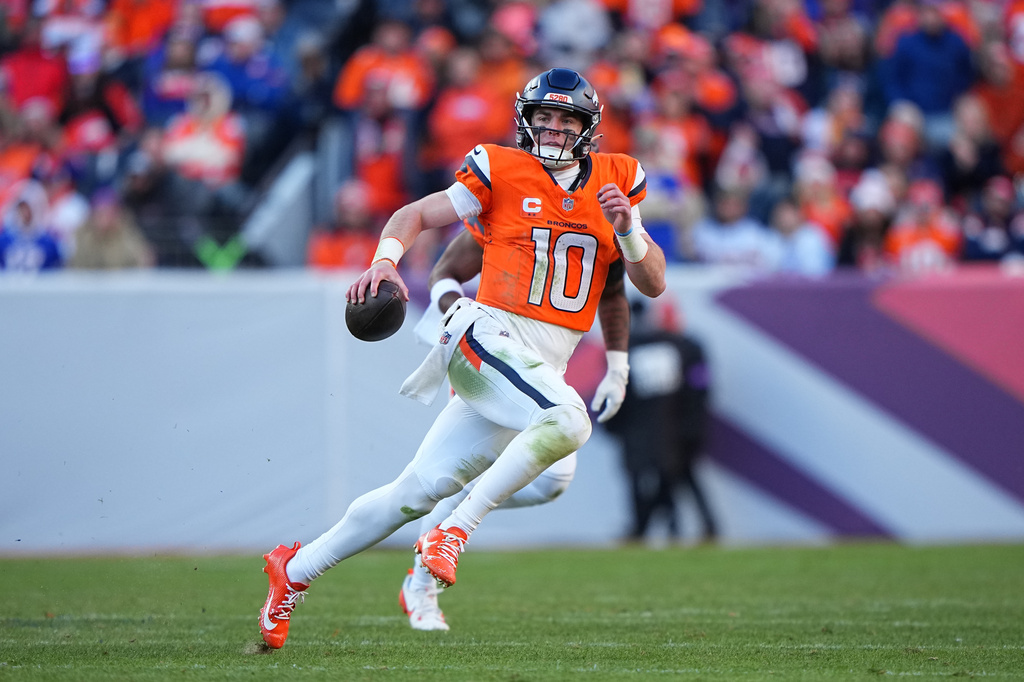 FILE - Denver Broncos quarterback Bo Nix (10) runs the ball against the Buffalo Bills in an NFL divisional playoff football game on Jan. 17, 2026 in Denver. (AP Photo/Bart Young, File)