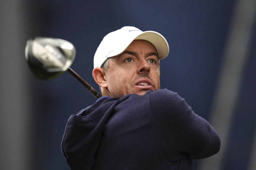 Rory McIlroy of Northern Ireland tees off the 17th during day four of the 2025 BMW PGA Championship at Wentworth Golf Club in Virginia Water, Surrey, England, Sunday Sept. 14, 2025. (Adam Davy/PA via AP)