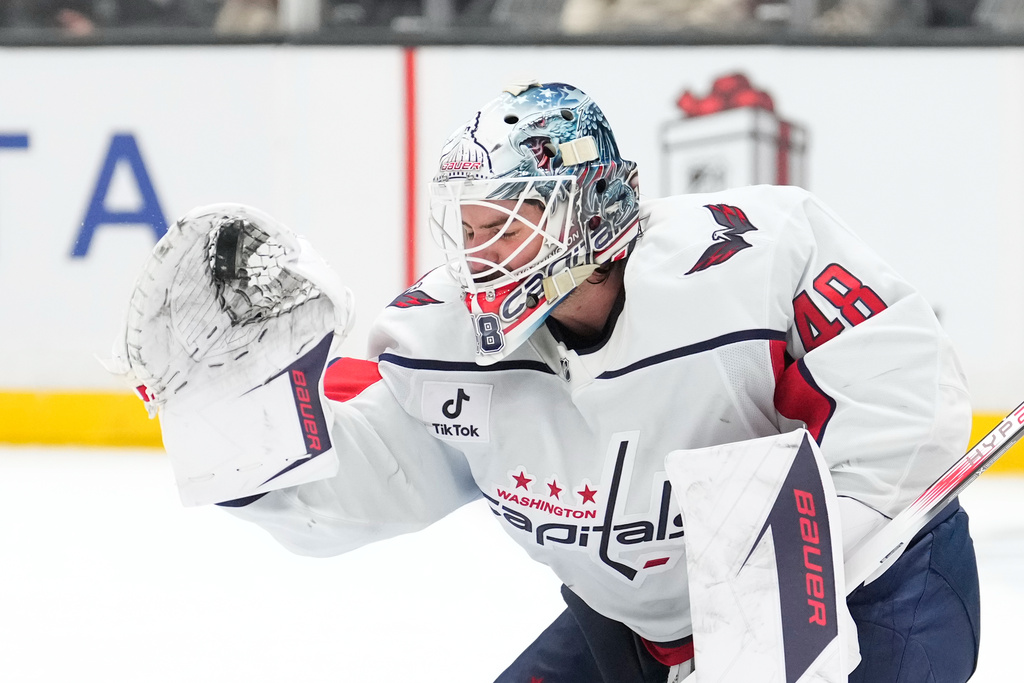 Washington Capitals goaltender Logan Thompson makes a glove save during the second period of an NHL hockey game against the Los Angeles Kings, Tuesday, Dec. 2, 2025, in Los Angeles. (AP Photo/Mark J. Terrill)