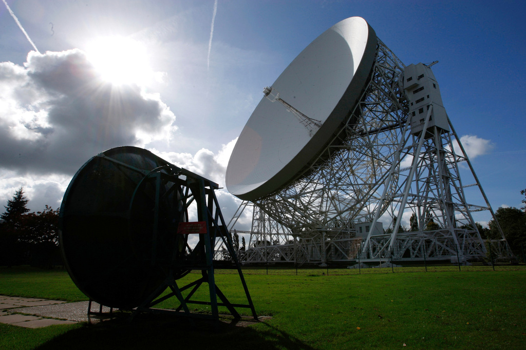 FILE - The Lovell Telescope, right, at the Jodrell Bank Observatory points skyward on the 50th anniversary of space travel, Macclesfield, England, Thursday Oct. 4, 2007. (AP Photo/Jon Super, file)