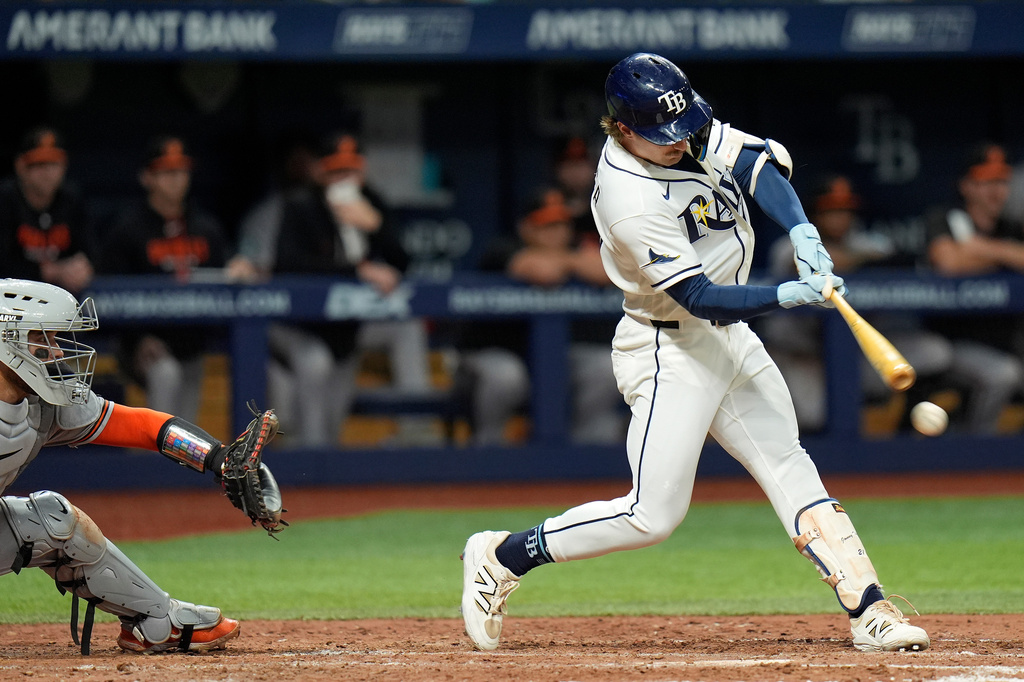 Tampa Bay Rays' Jonny DeLuca lines a two-run single off Baltimore Orioles pitcher Josh Walker during the seventh inning of a baseball game Monday, Aug. 17, 2026, in St. Petersburg, Fla. (AP Photo/Chris O'Meara)