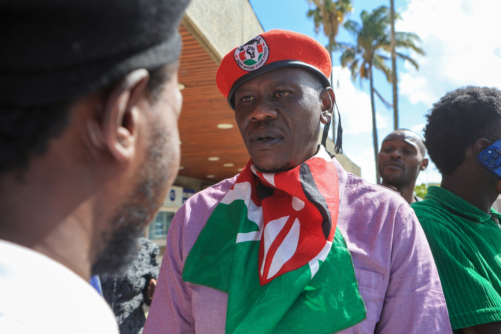Kenyan human rights activist Bob Njagi arrives at Jomo Kenyatta International Airport (JKIA) in Nairobi, Kenya, Saturday, Nov. 9, 2025. (AP Photo/Andrew Kasuku)
