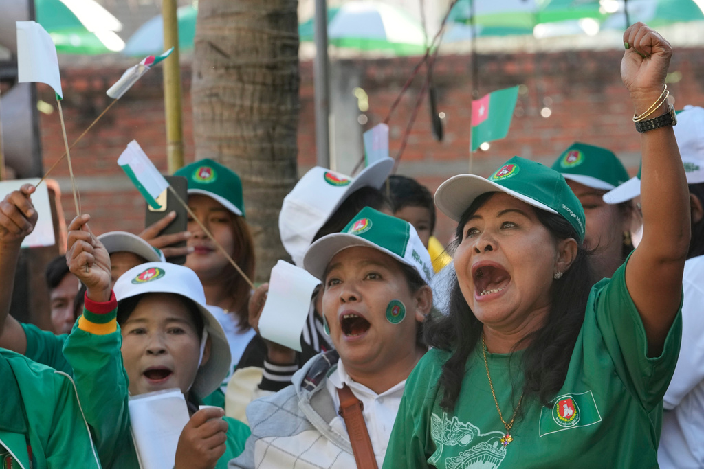 Supporters of the military-backed Union Solidarity and Development Party (USDP) cheer during the final day of campaign for the first phase of a general election in Naypyitaw, Myanmar, Friday, Dec. 26, 2025. (AP Photo/Aung Shine Oo)