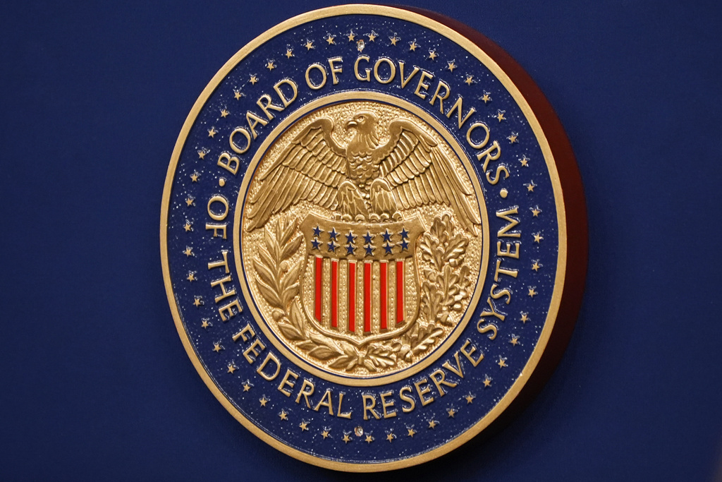 The Federal Reserve Chair logo appears on a podium at the Federal Reserve, Wednesday, Dec. 10, 2025, in Washington. (AP Photo/Jacquelyn Martin)