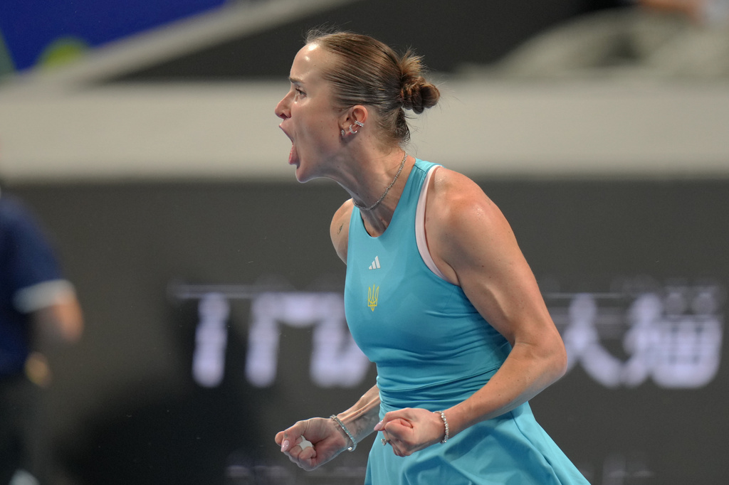 Elina Svitolina of Ukraine celebrates winning her match against Jasmine Paolini of Italy in the Billie Jean King Cup women's singles semifinal between Ukraine and Italy, in Shenzhen, China, Saturday, Sept. 26, 2026. (AP Photo/Andy Wong)