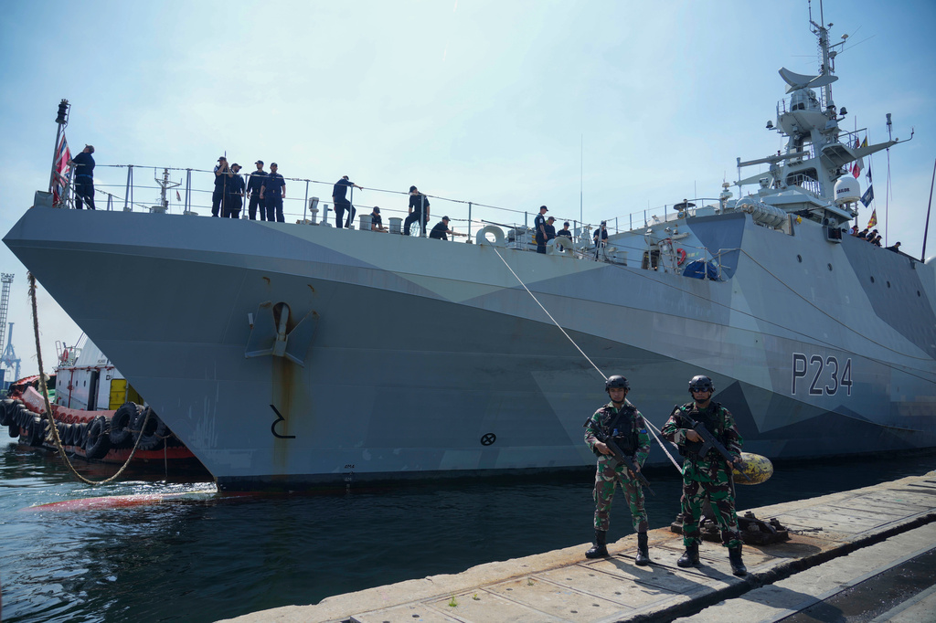FILE - Indonesian soldiers stand guard as Royal Navy offshore patrol vessel HMS Spey is docked at Tanjung Priok Port during a port visit in Jakarta, Indonesia, Wednesday, Jan. 15, 2025. (AP Photo/Tatan Syuflana, File)