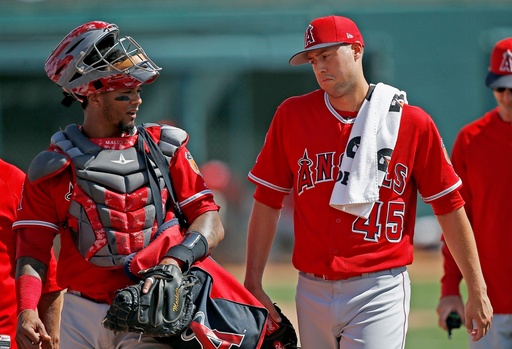 FILE - Los Angeles Angels starting pitcher Tyler Skaggs (45) talks with catcher Martin Maldonado, left, after warming up in the bullpen prior to a spring training baseball game against the Chicago White Sox, March 4, 2017, in Glendale, Ariz. (AP Photo/Ross D. Franklin, File) FILE - Los Angeles Angels starting pitcher Tyler Skaggs (45) talks with catcher Martin Maldonado, left, after warming up in the bullpen prior to a spring training baseball game against the Chicago White Sox, March 4, 2017, in Glendale, Ariz. (AP Photo/Ross D. Franklin, File)