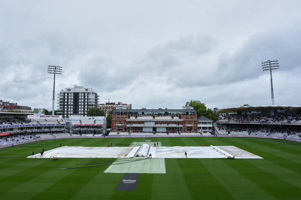Covers protect the playing surface at the Lord's cricket ground as play gets delayed by rain on day three of the second cricket test match between England and Pakistan in London, Saturday, Aug. 29, 2026. (AP Photo/Dave Shopland)