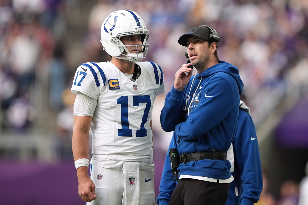 Indianapolis Colts quarterback Daniel Jones (17) talks with head coach Shane Steichen during the first half of an NFL football game against the Minnesota Vikings in Minneapolis, Sunday, Oct. 25, 2026. (AP Photo/Ellen Schmidt)