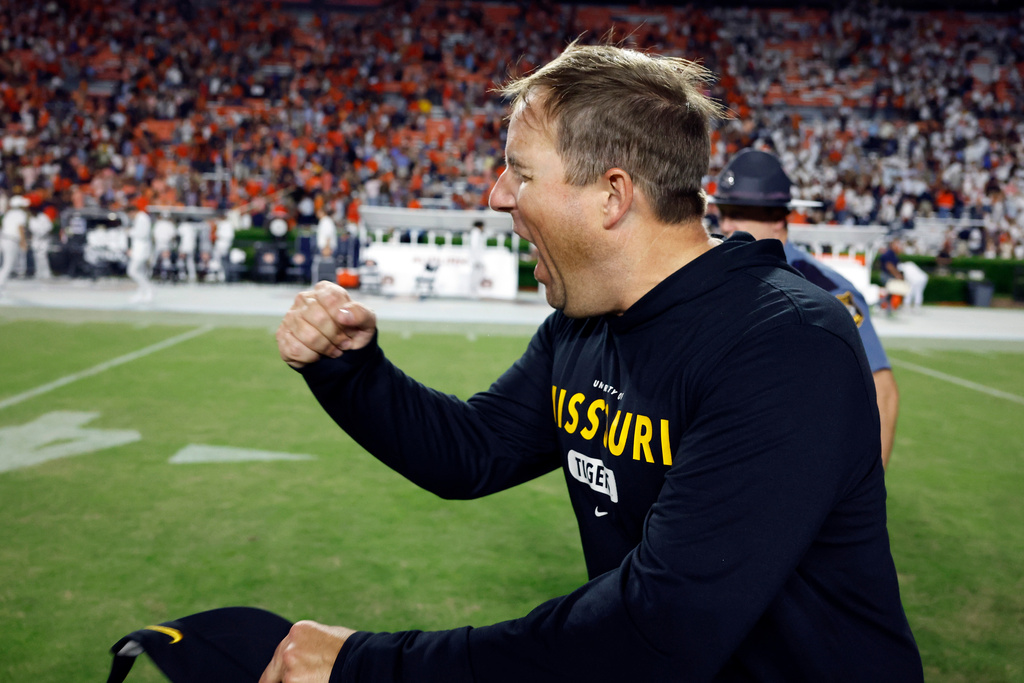 Missouri head coach Eli Drinkwitz reacts after defeating Auburn during the second overtime of an NCAA college football game, Saturday, Oct. 18, 2025, in Auburn, Ala. (AP Photo/Butch Dill)
