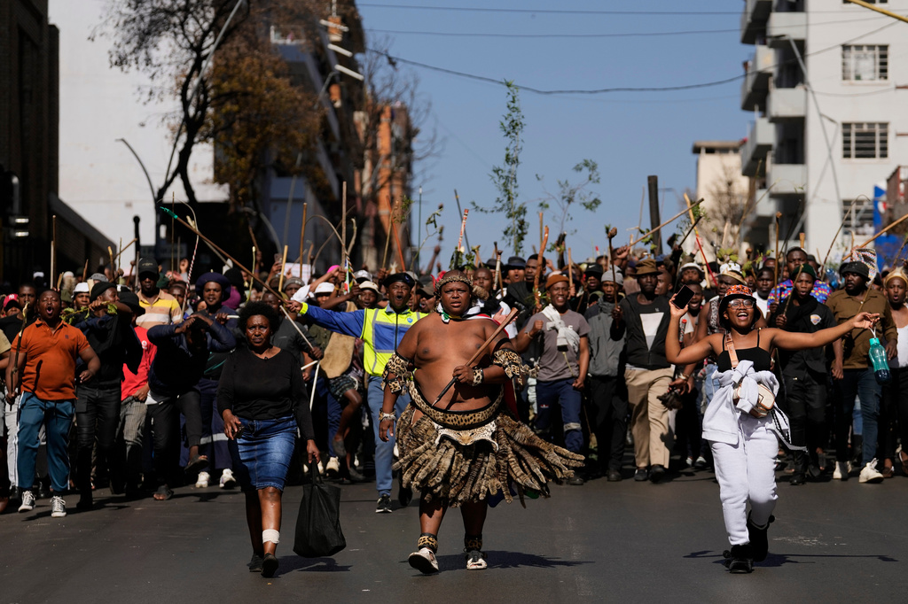 Protesters march against illegal immigration, in Johannesburg, South Africa, Tuesday, June 30, 2026. (AP Photo/Themba Hadebe)
