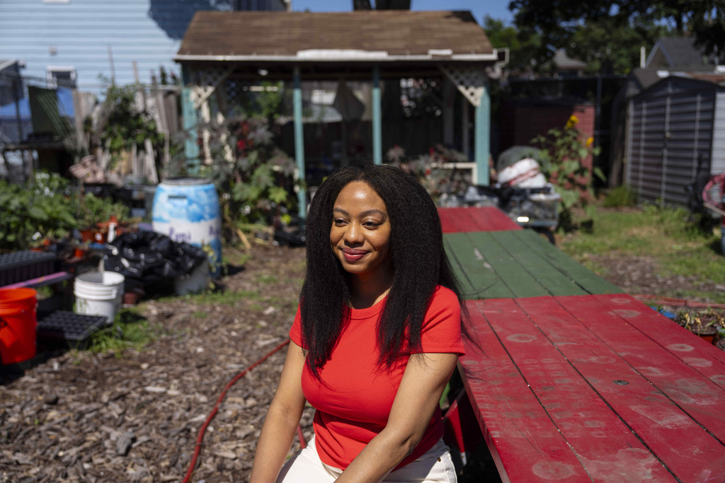 Alicia White, president and founder of the Project Petals, poses outside Paradise Community Garden, Friday, Aug. 8, 2025, in Inwood, N.Y. (AP Photo/Yuki Iwamura)