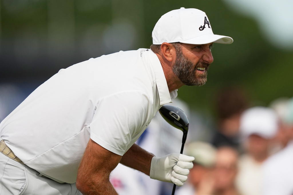 Dustin Johnson watches his tee shot on the fifth hole during the second round of the U.S. Open golf tournament at Shinnecock Hills Golf Club in Southampton, N.Y., Friday, June 19, 2026.(AP Photo/Gerald Herbert)