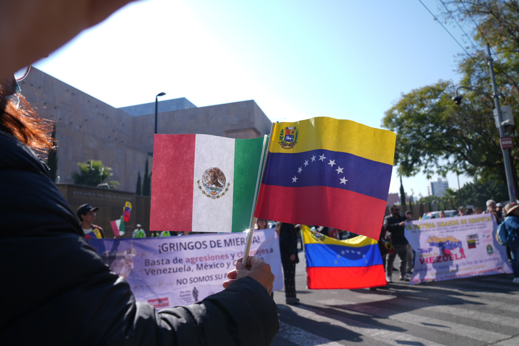 People protest outside the U.S. Embassy against the capture of President Nicolas Maduro, in Mexico City, Saturday, Jan. 3, 2026. (AP Photo/Marco Ugarte)