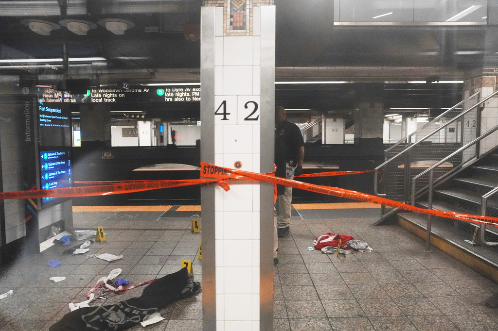Police investigate the scene after a reported stabbing and shooting at the Grand Central subway station in New York on Saturday, April 11, 2026. (AP Photo/Ryan Murphy)