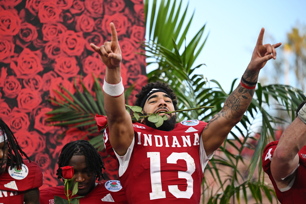 Indiana wide receiver Elijah Sarratt (13) celebrates after a win over Alabama in the Rose Bowl College Football Playoff quarterfinal game Thursday, Jan. 1, 2026, in Pasadena, Calif. (AP Photo/Kyusung Gong)