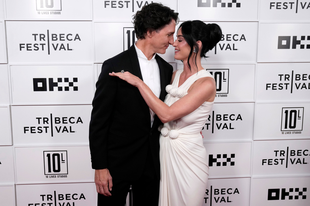 Justin Trudeau, left, and Katy Perry attend the "Katy Perry: The Lifetimes Tour - Live from Paris" world premiere at the OKX Theater at BMCC Tribeca Performing Arts Center during the Tribeca Festival on Monday, May 8, 2026, in New York. (Photo by Charles Sykes/Invision/AP)