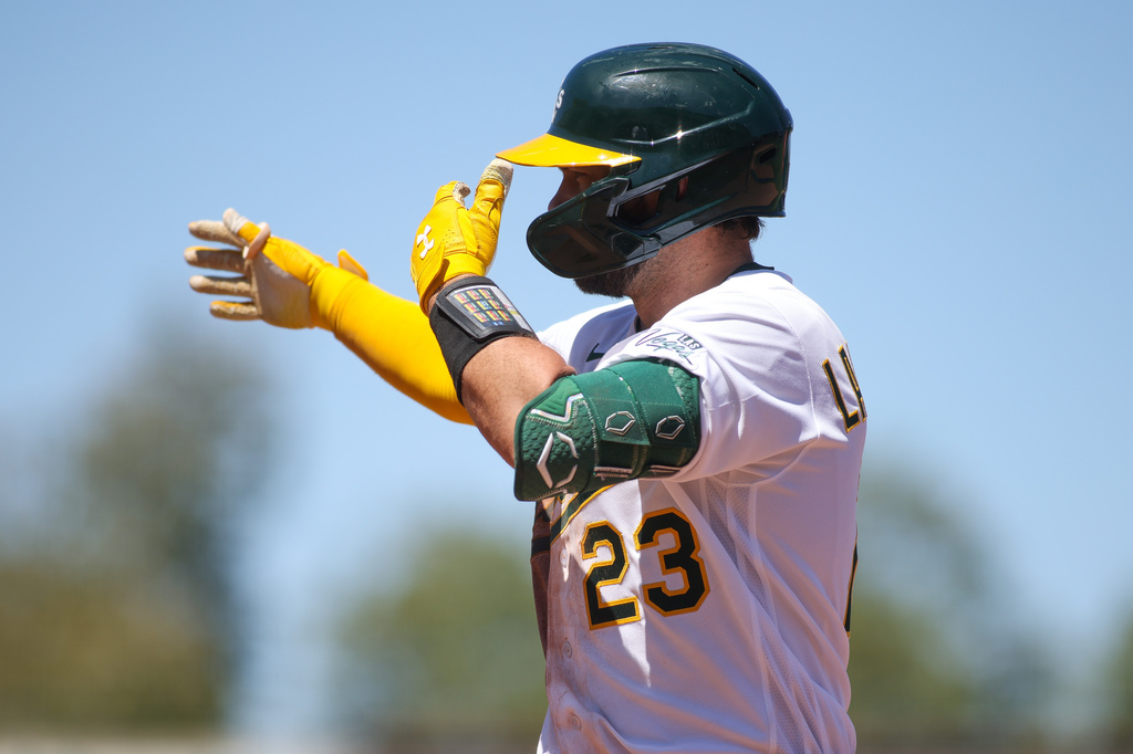 Athletics' Shea Langeliers gestures towards his dugout after hitting a two RBI single during the seventh inning of a baseball game against the St. Louis Cardinals, Thursday, May 14, 2026, in West Sacramento, Calif. (AP Photo/Scott Marshall)