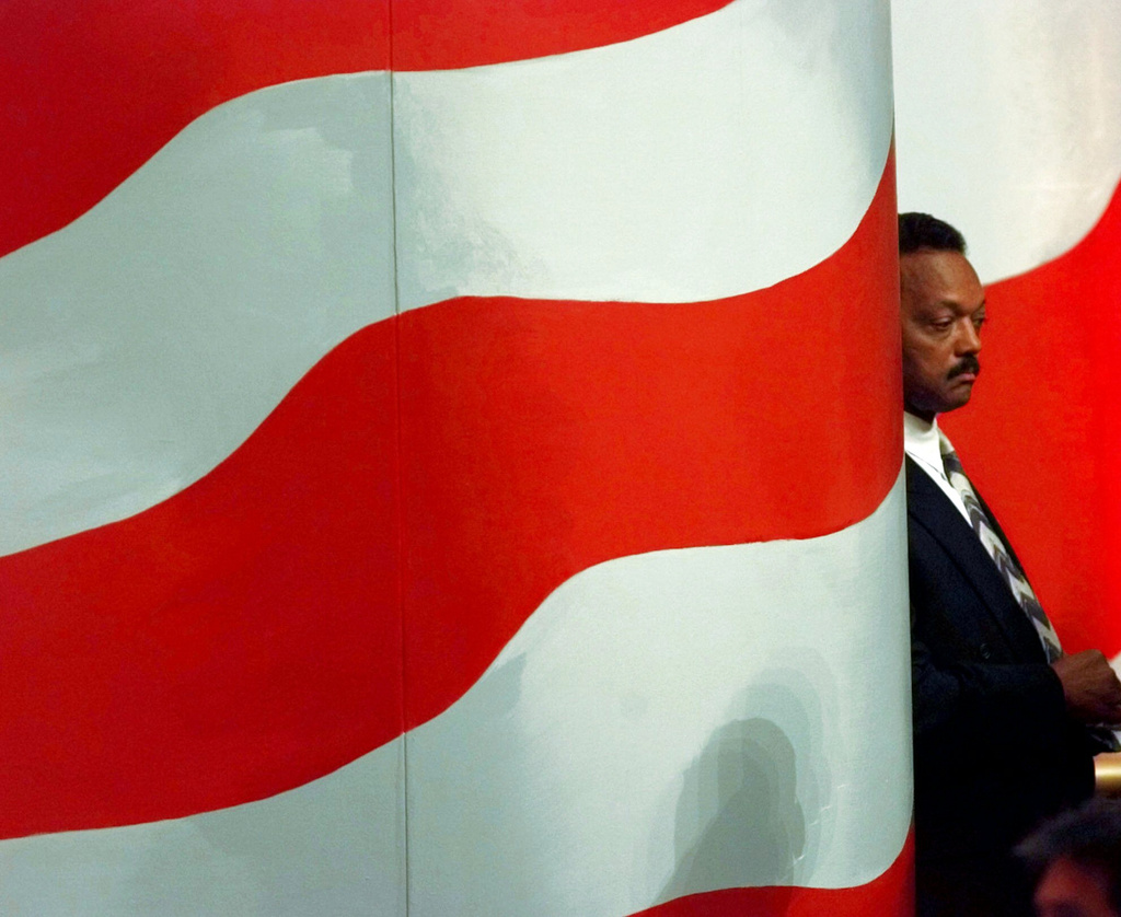 FILE - The Rev. Jesse Jackson waits while son Jesse Jackson Jr., introduces him to delegates at the United Center Tuesday, Aug. 27, 1996, in Chicago during the Democratic National Convention. (AP Photo/Ron Edmonds, File)