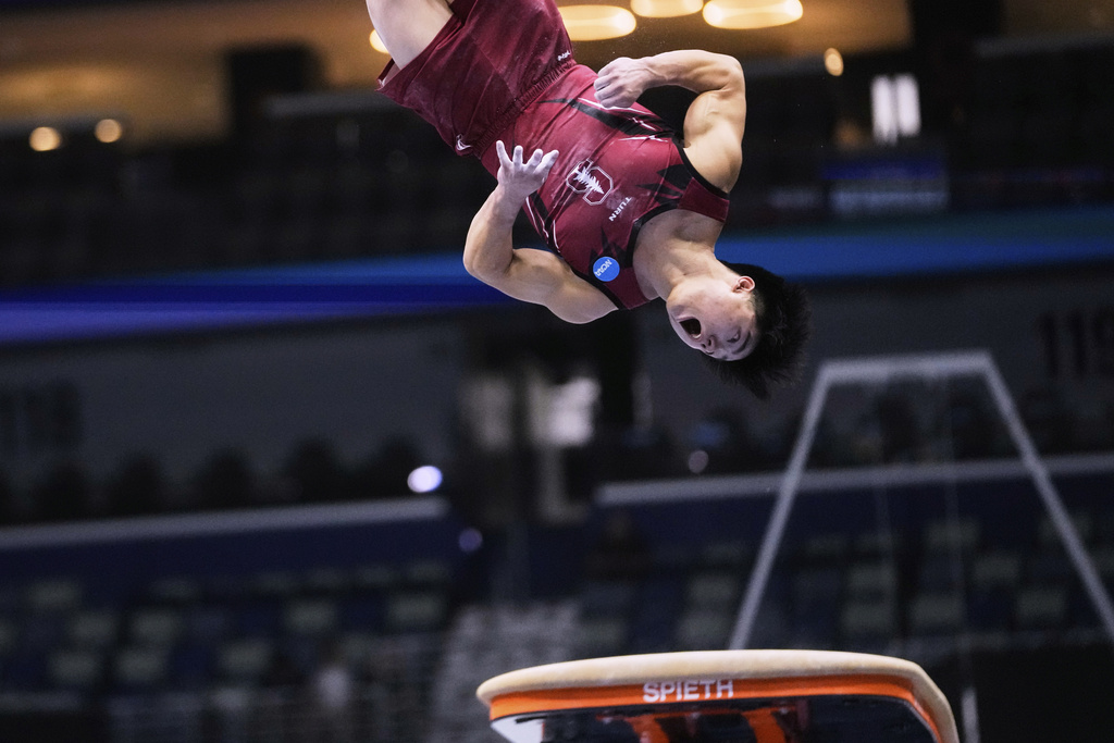 Asher Hong of Stanford University competes on the vault during the senior men's finals of the U.S. Gymnastics Championships in New Orleans, Saturday, Aug. 9, 2025. (AP Photo/Gerald Herbert)