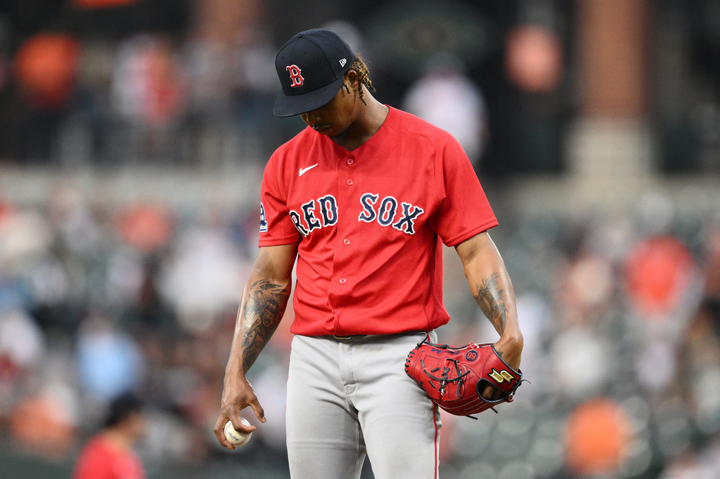Boston Red Sox pitcher Brayan Bello pauses during the first inning of a baseball game against the Baltimore Orioles, Friday, April 24, 2026, in Baltimore. (AP Photo/Nick Wass)