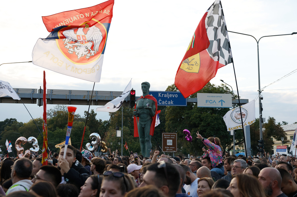 People welcome a group of university students at the end of their cycling tour of the Balkan country ahead of an early election next month challenging populist President Aleksandar Vucic, in Kragujevac, Serbia, Saturday, Sept. 26, 2026. (AP Photo/Marko Drobnjakovic)
